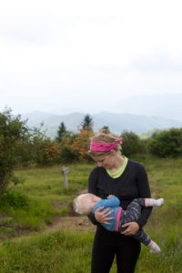 Nicole Martin pauses in the misty mountains of Great Smoky Mountains National Park to nurse her one-year-old.