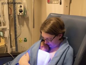 Erin holding her baby in nicu 